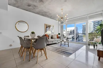 a living room with a table and a couch at Midblock Midtown Miami 1B W Spa Pool Gym in Miami