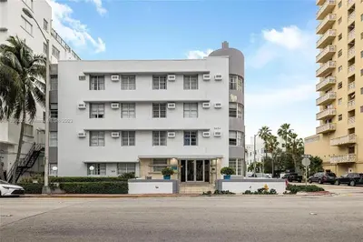 a large white building on a city street at Contemporary chic, next to the beach - 1 Bedroom in Miami Beach