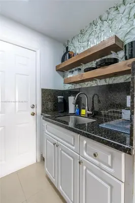 a kitchen with a sink and a counter top at Contemporary chic, next to the beach - 1 Bedroom in Miami Beach