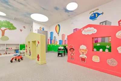 a childrens room with a pink wall and a city at Stylish Studio with Pool View at the Heart of Downtown Doral in Miami