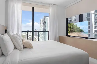 a bedroom with a large bed with a large window at Downtown Miami 2BR-2BA Panoramic City Views in Miami