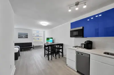 a kitchen with a counter and a table in a room at Ocean Dr 1BR • Miami Beach Getaway in Miami Beach
