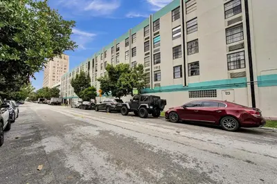a red car parked in front of a building at Ocean Dr 1BR • Miami Beach Getaway in Miami Beach