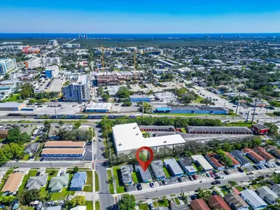 an aerial view of a city with a red marker at Triplex with 3 Bedrooms, 6 Min/Beach+Free Parking in Dania Beach