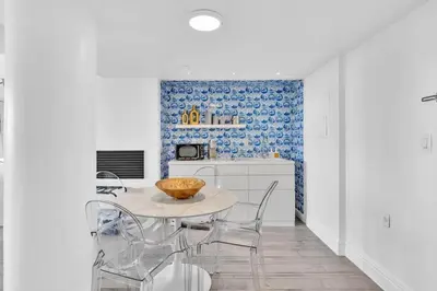 a kitchen with a table and chairs in a room at Brand New Mondrian - Miami Beach Waterfront Condo in Miami Beach