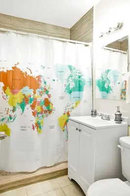 a bathroom with a map of the world shower curtain at New Mimo 8 New -Walkable - Smart TV - Nespresso - Free Parking in Miami