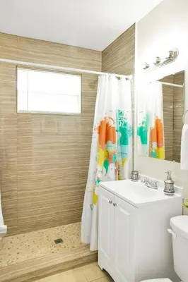 a bathroom with a sink and a shower curtain at New Mimo 8 New -Walkable - Smart TV - Nespresso - Free Parking in Miami
