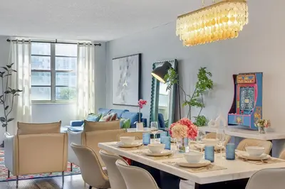a dining room with a table and chairs at Beachfront Oasis in Sunny Isles 4BR, Pool & Tennis in Sunny Isles Beach