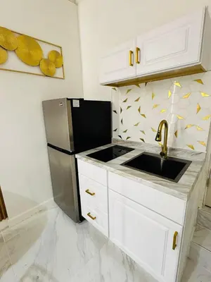 a kitchen with a sink and a refrigerator at Stylish Studio in Heart of Miami in Miami