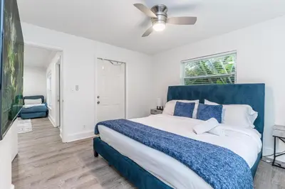 a bedroom with a large bed and a ceiling fan at New Apt 2 Bed 2 Bath with Amazing PATIO in Fort Lauderdale