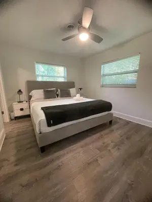 a bedroom with a bed and a ceiling fan at New Apt 2 Bed 2 Bath with Amazing PATIO in Fort Lauderdale