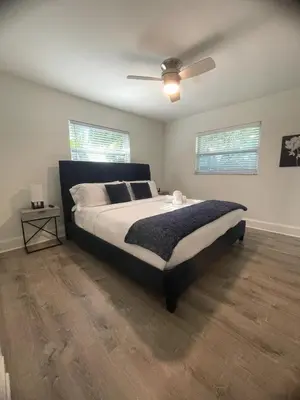 a bedroom with a bed and a ceiling fan at New Apt 2 Bed 2 Bath with Amazing PATIO in Fort Lauderdale