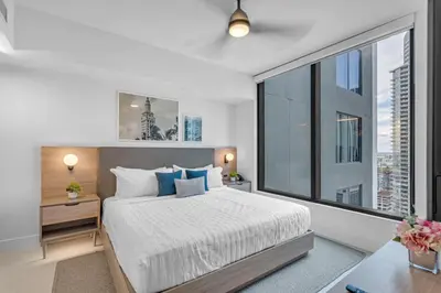 a bedroom with a bed and a large window at Experience Miami Vibes in the Heart of Downtown in Miami