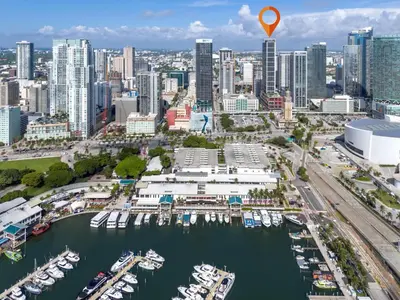 an aerial view of a city with boats docked at Experience Miami Vibes in the Heart of Downtown in Miami