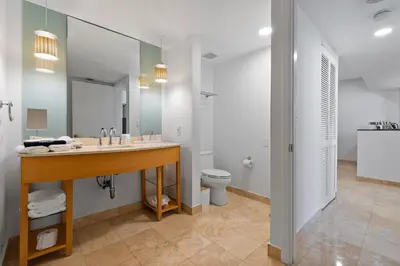 a bathroom with a sink and a toilet at Luxury Top-Level Oasis - Oceanfront Views & Resort Perks in Sunny Isles Beach