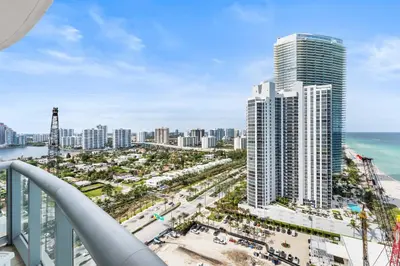 an aerial view of a city with tall buildings at Luxury Top-Level Oasis - Oceanfront Views & Resort Perks in Sunny Isles Beach