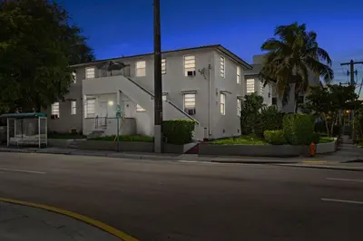 a white building on the corner of a street at Brickell Stay: Near Beach Downtown Pet-Friendly in Miami