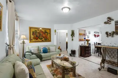 a living room with a couch and a table at Little Havana 2BR – Near Brickell Midtown in Miami