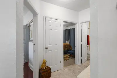 a hallway with a door leading to a bedroom at Little Havana 2BR – Near Brickell Midtown in Miami