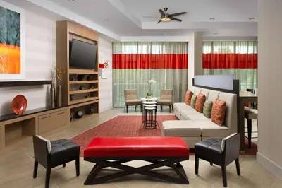 a living room with a couch and a tv at Homewood Suites by Hilton Miami Downtown/Brickell in Miami