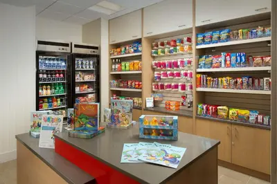 a store with a counter with food and drinks at Homewood Suites by Hilton Miami Downtown/Brickell in Miami