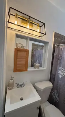 a bathroom with a sink and a toilet and a mirror at Noemi's Studio Suite Steps To Marlins Stadium At Little Havana in Miami