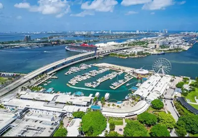 an aerial view of a marina with boats in the water at Miami-Brickell Luxury 2BR-2BATH with skyline VIEWS - walking distance to KASEYA-HEAT ARENA & BAYSIDE - Port of MIAMI cruise ships in Miami