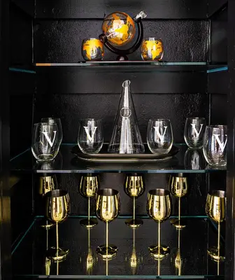 a shelf with wine glasses and a trophy on it at Top Villa Near Beach with Game Room, Hot Tub and Pool in Pembroke Pines
