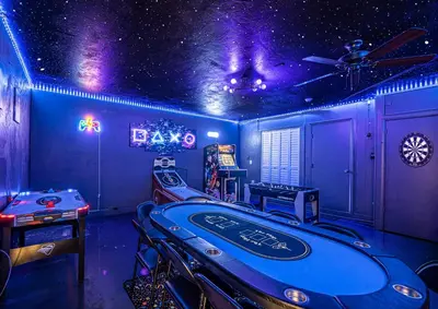 a room with a pool table in a room with purple lights at Top Villa Near Beach with Game Room, Hot Tub and Pool in Pembroke Pines