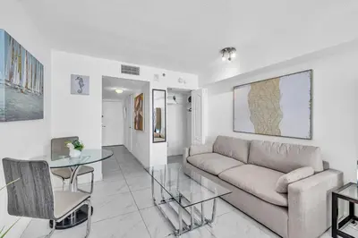 a living room with a couch and a table at Central Unit in Heart of Brickell in Miami