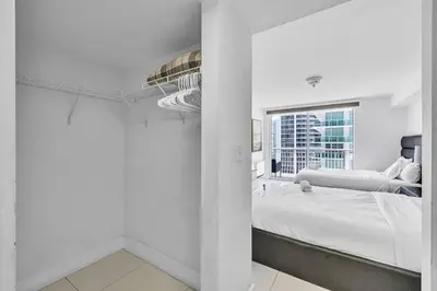 a white room with a bed and a window at Spacious 1 Bed 1 BTH Brickell Ocean View in Miami