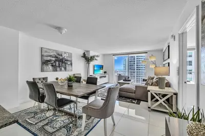 a living room with a table and chairs and a couch at Spacious 1 Bed 1 BTH Brickell Ocean View in Miami