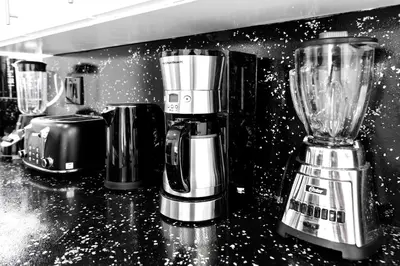 a kitchen with three coffees and a blender on a counter at Relax & Fun Hollywood Private Pool | Arcade Game in Hollywood