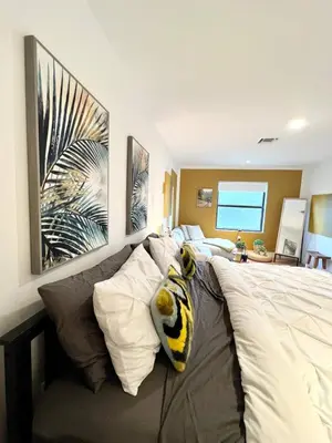 a bedroom with a bed with a stuffed animal on it at Lux Retreat with Pool Near Beach in Fort Lauderdale