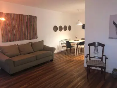 a living room with a couch and a table at 2 Bedroom Apartment Free Reserved Parking in Miami