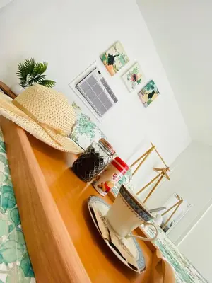 a hat on top of a guitar in a bedroom at Walk to Calle 8 - Authentic Cuban Experience in Miami