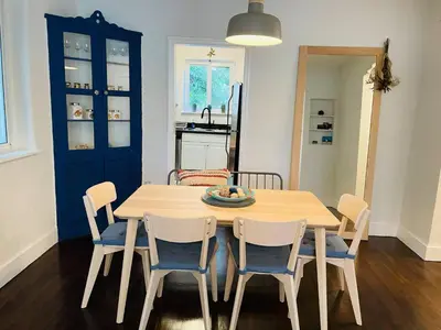 a kitchen and dining room with a table and chairs at 3 Bedroom Apartment with Backyard Oasis in Miami