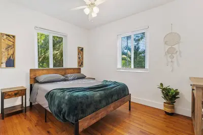 a bedroom with a bed and two windows at Families Welcome 3 Bedroom Oasis with Parking in Miami