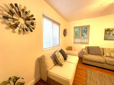 a living room with a couch and a chandelier at Families Welcome 3 Bedroom Oasis with Parking in Miami