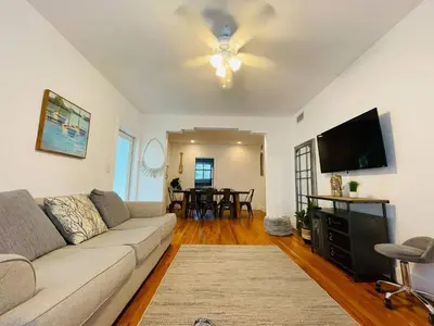 a living room with a couch and a flat screen tv at Families Welcome 3 Bedroom Oasis with Parking in Miami