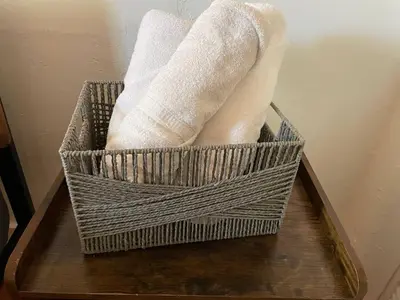 a basket of paper towels on a wooden table at Families Welcome 3 Bedroom Oasis with Parking in Miami
