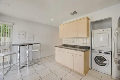 a kitchen with a washer and dryer in it at Intracostal Beauty in Fort Lauderdale
