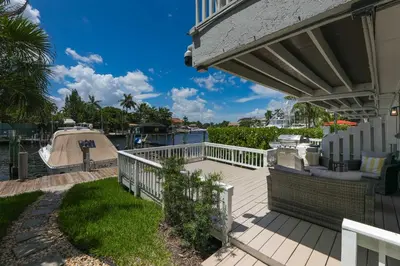 a house with a white fence and a deck at Intracostal Beauty in Fort Lauderdale