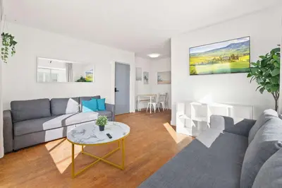 a living room with a couch and a table at Modern Miami Beach Apt King & Sofa Bed Comfort in Miami Beach