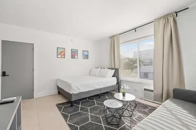 a small room with a bed and a couch at Miami Magic 1BR 4 Guests in Miami Beach