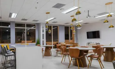 a dining room with tables and chairs and a tv at Brickell 1 Bed 1 Bath Free Parking in Miami