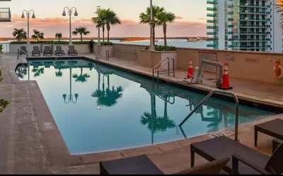 a swimming pool on the roof of a building at Brickell 1 Bed 1 Bath Free Parking in Miami