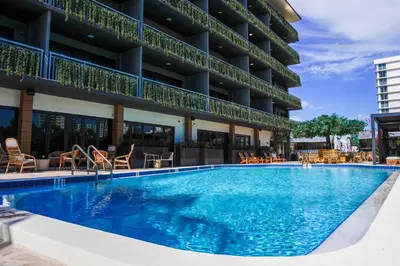 a swimming pool in front of a hotel at Barley House Hotel, Trademark Collection by Wyndham in Fort Lauderdale