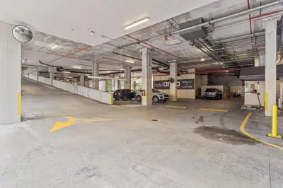 an empty parking garage with cars parked in it at Private Residences at Hotel Arya by SoFLA Vacations in Miami