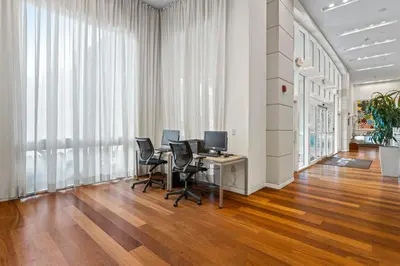 an office with a desk with chairs and a computer at Private Residences at Hotel Arya by SoFLA Vacations in Miami